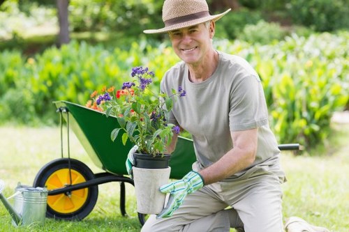 Garden maintenance team tidying a Wimbledon back garden